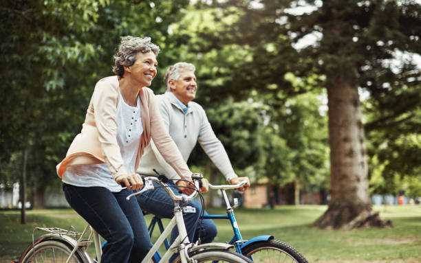 active senior couple cycling together